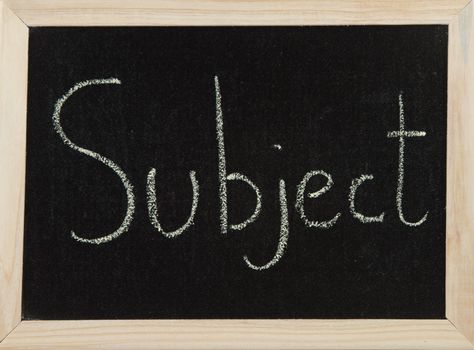 A black board with a wooden frame and the word 'SUBJECT' written in chalk.