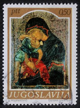 YUGOSLAVIA - CIRCA 1974: A greeting Christmas stamp printed in Yugoslavia shows Madonna and Child