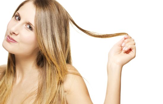 beautiful cheeky woman playing with her hair on white background