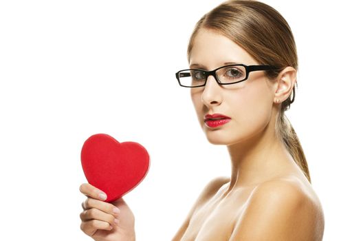 young beautiful woman with black glasses holding red heart on white background
