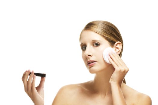 beautiful woman applying makeup on white background