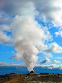 Big solfatara with steam and vapor into the sky in Iceland