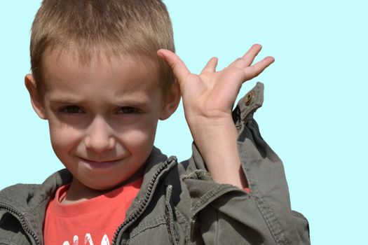 happy little boy with a smiling expression showing fingers