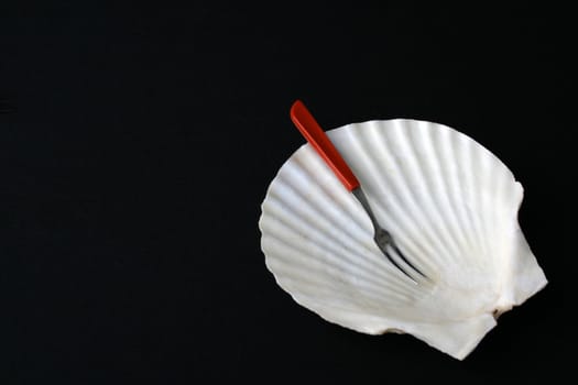 Fancy shell shaped dish with fork for starters