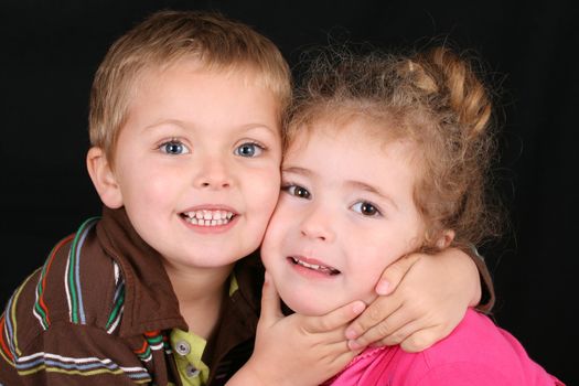 Beautiful young girl with curly hair and her cute boy friend
