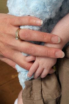 Close up of a mother and baby hands
