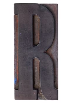 letter R - isolated antique wood letterpress printing  block stained by color inks