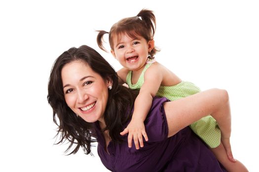 Happy laughing toddler girl playing with mom doing a fun piggyback ride, isolated.
