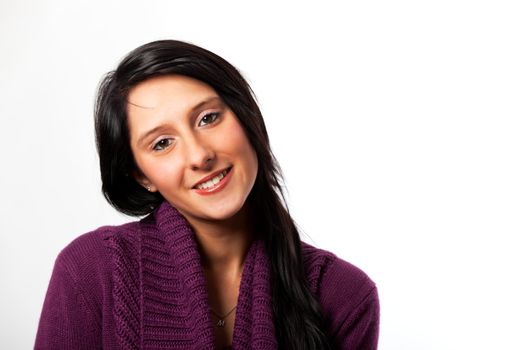 smiling in a pink sweater