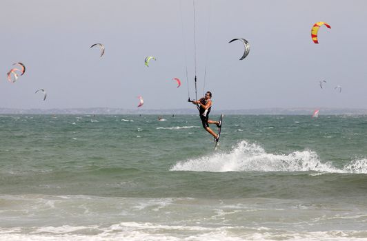 Kiteboarder enjoy surfing in ocean. Vietnam