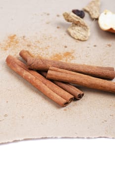 Cinnamon stick closeup on a brown background