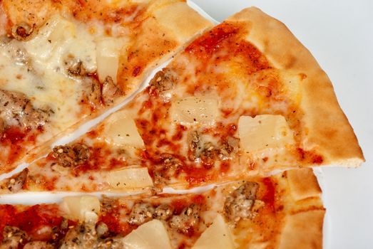 Hawaiian pizza with roasted chicken, pineapple, garlic and mozzarella cheese