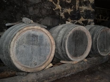 Barrels in the wine-cellar of a rural house.