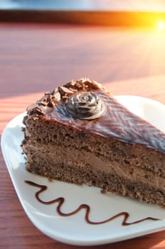 piece of chocolate cake at white plate