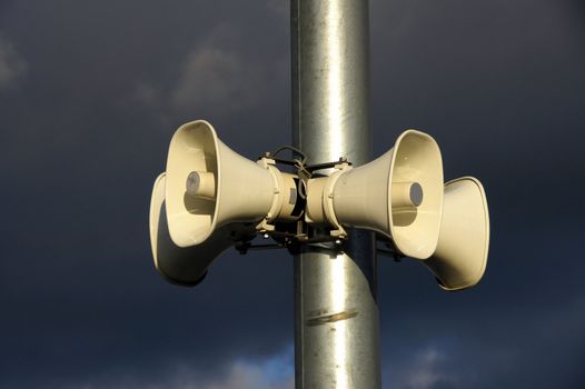 Loudspeakers on a background of the blue sky