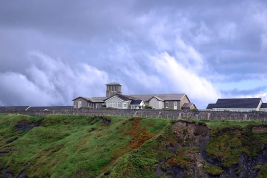 a convent on the edge of cliffs in ireland