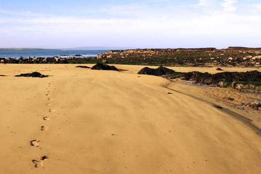 a scenic view of footprints on beautiful ballybunion beach in kerry ireland