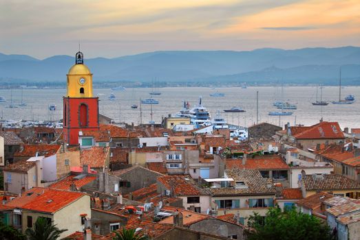 View at St.Tropez and anchored ships at sunset in French Riviera