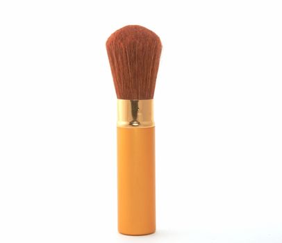 Soft cosmetic brush on a white background