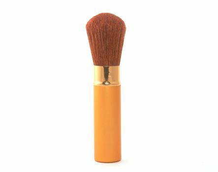 Soft cosmetic brush on a white background