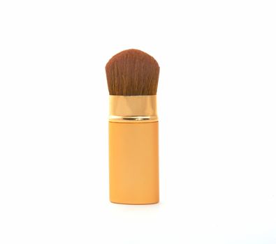 Soft cosmetic brush on a white background