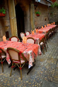 Outdoor restaurant patio on the street of Sarlat, Dordogne region, France