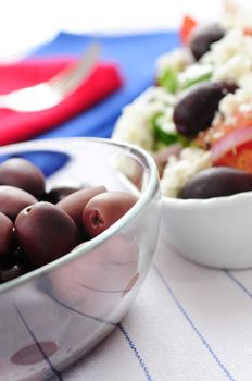 Black kalamata olives and greek salad with feta cheese 