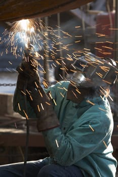a welder working at shipyard on dayshift