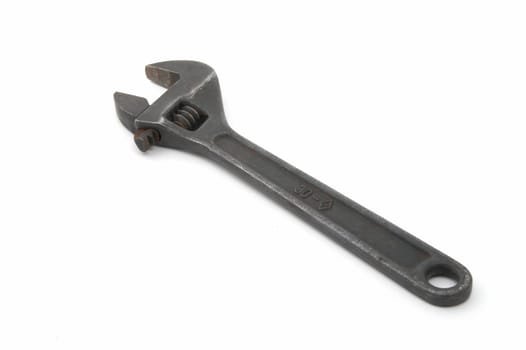 Iron adjustable spanner on a white background