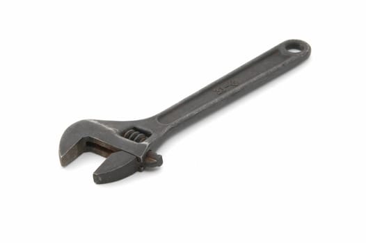 Iron adjustable spanner on a white background