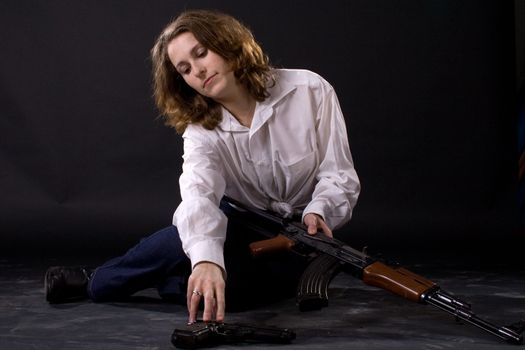 woman on black with guns
