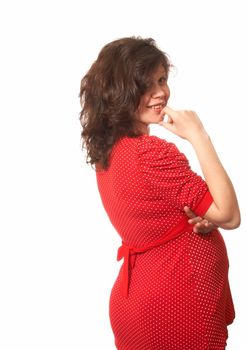 Portrait of the pregnant woman in a red dress with white points