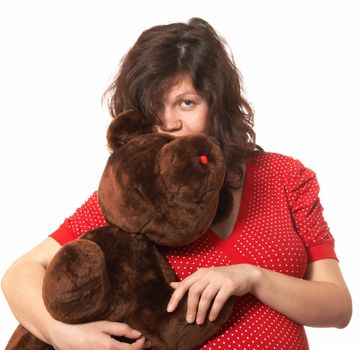 Portrait of the pregnant woman with the teddy bear