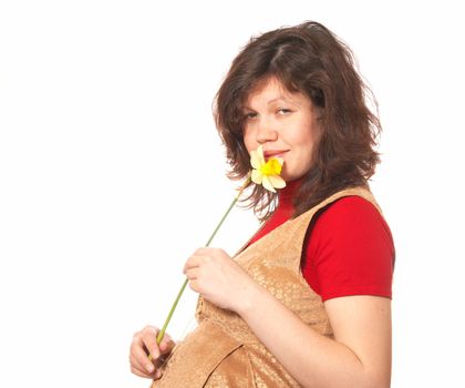 Portrait of the pregnant woman with a flower