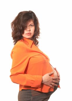 Portrait of the pregnant woman in an orange shirt