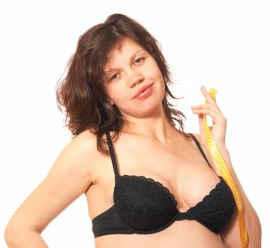 Portrait of the pregnant womanin a black bra