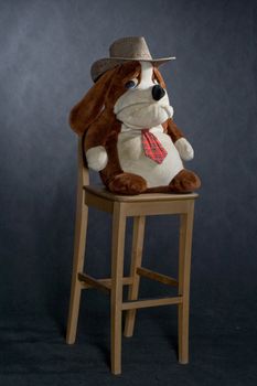 wooden lacquered chair and toy with western hat
