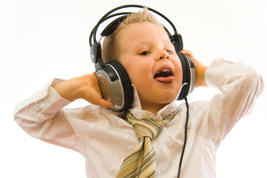 Child with headphones on head enjoying the music