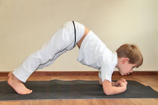 Baby yoga at home. Rabbit pose, sasangasana