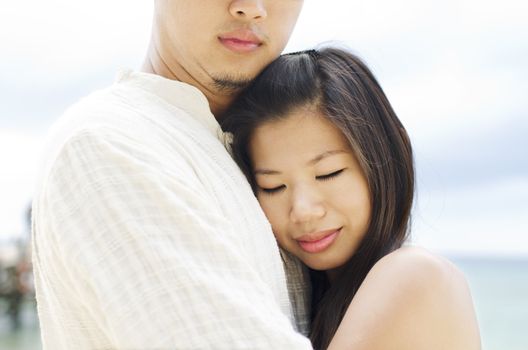 Loving Asian Couple at outdoor beach