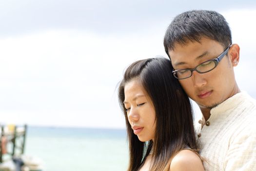 Loving Asian Couple at outdoor beach
