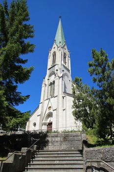 Facade of roman catholic church of Saint-Imier by sunny day, Jura, Switzerland. It was built in 1866.