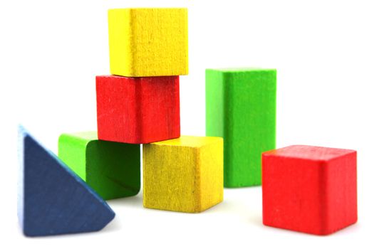 Wooden building blocks isolated on white background