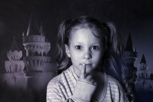 Portrait of the thoughtful girl on a background of a fantastic palace