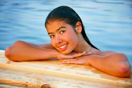 Head girl with wet hair lying on the hands