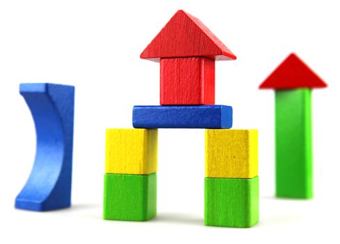 Wooden building blocks isolated on white background