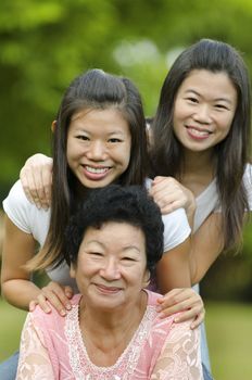 Happy Asian Senior lady and her daughters
