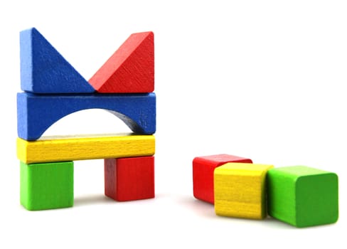 Wooden building blocks isolated on white background