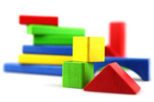 Wooden building blocks isolated on white background
