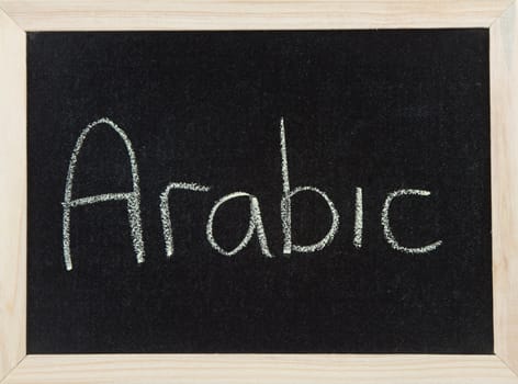 A black board with a wooden frame and the word 'ARABIC' written in chalk.